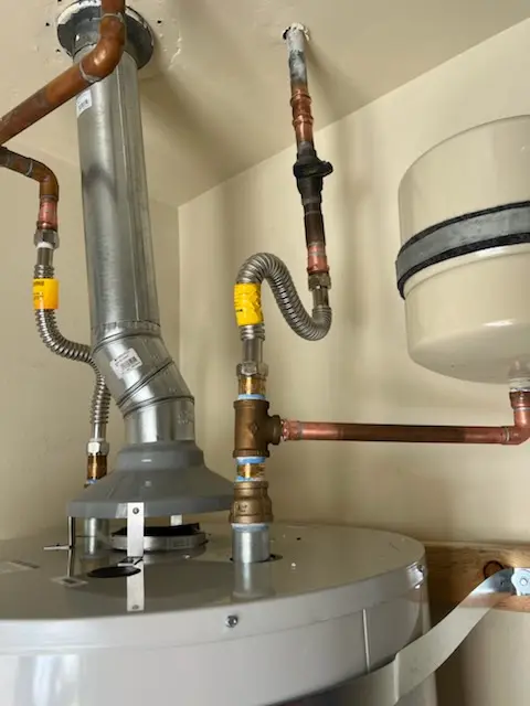 Water heater installation and plumbing repair in Mound